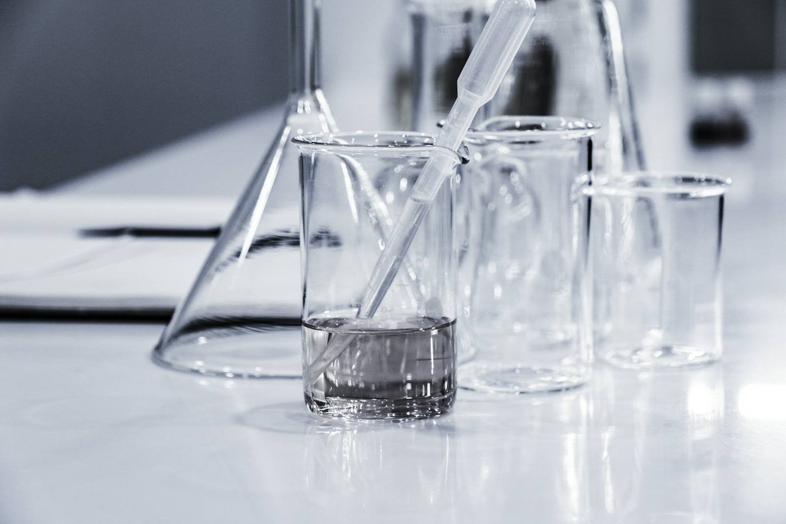Clean laboratory glassware on a white bench